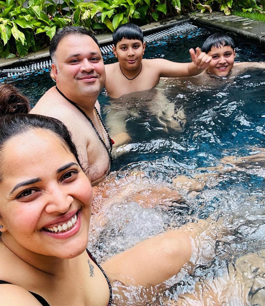 Anasuya swimming with husband and sons