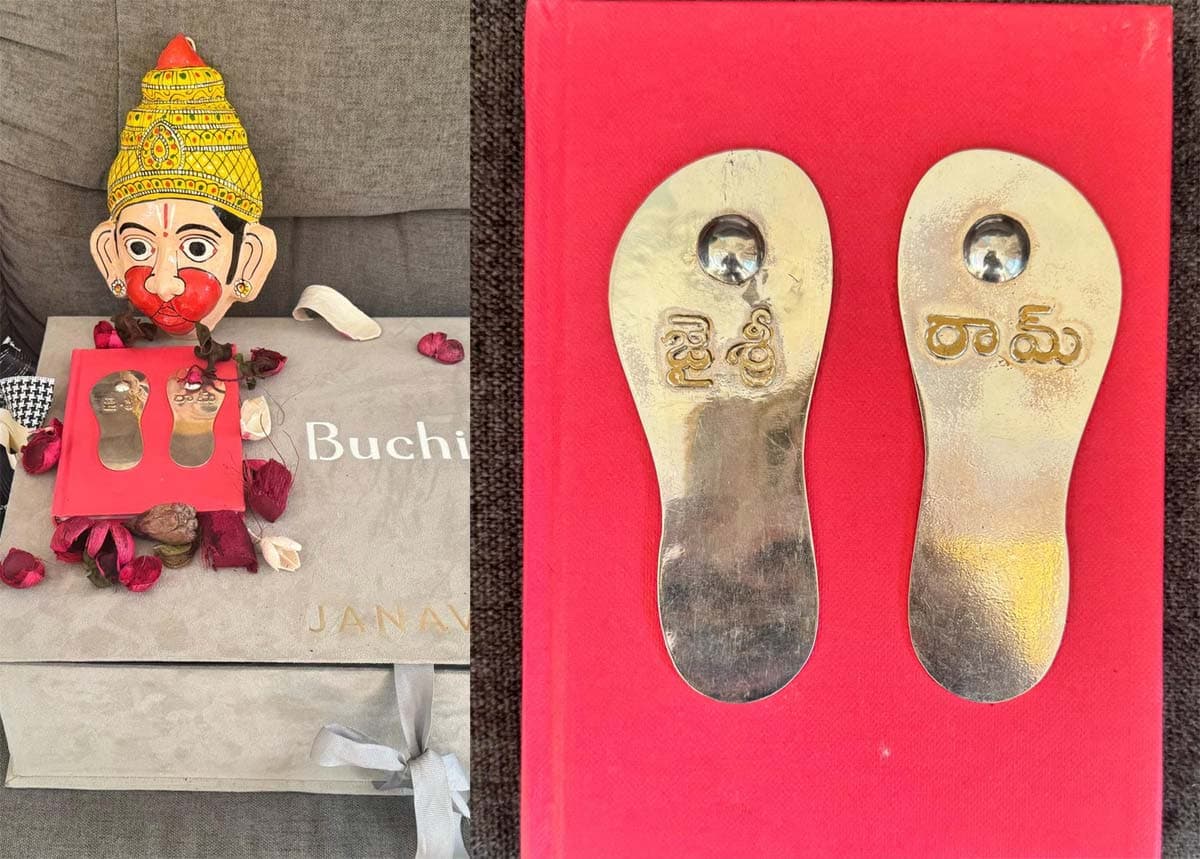 Buchi Babu receives a gift set from Ram Charan