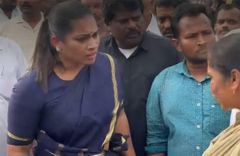 Divvela Madhuri stages a protest in front of the police station