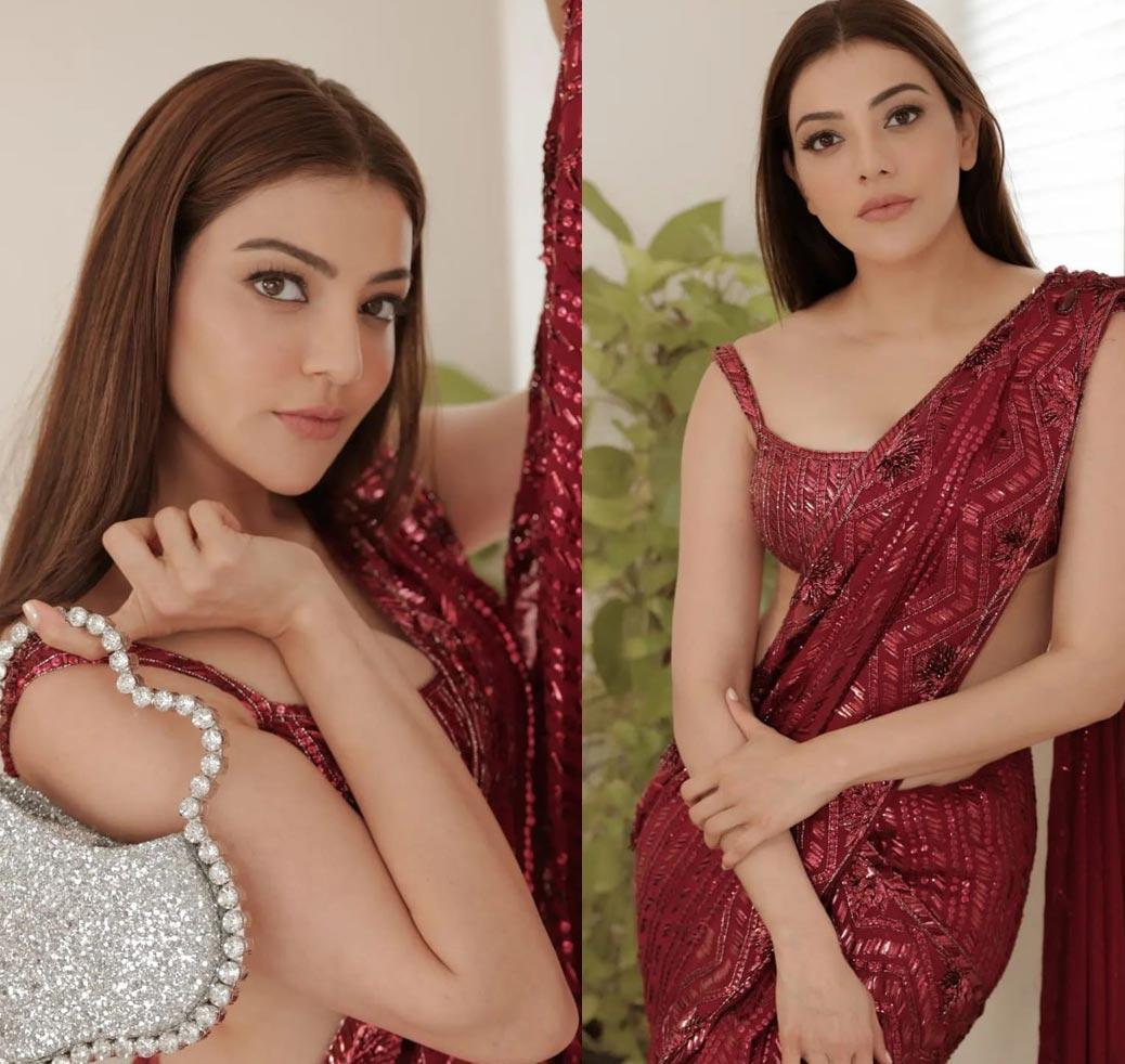 Kajal sizzling in a maroon saree