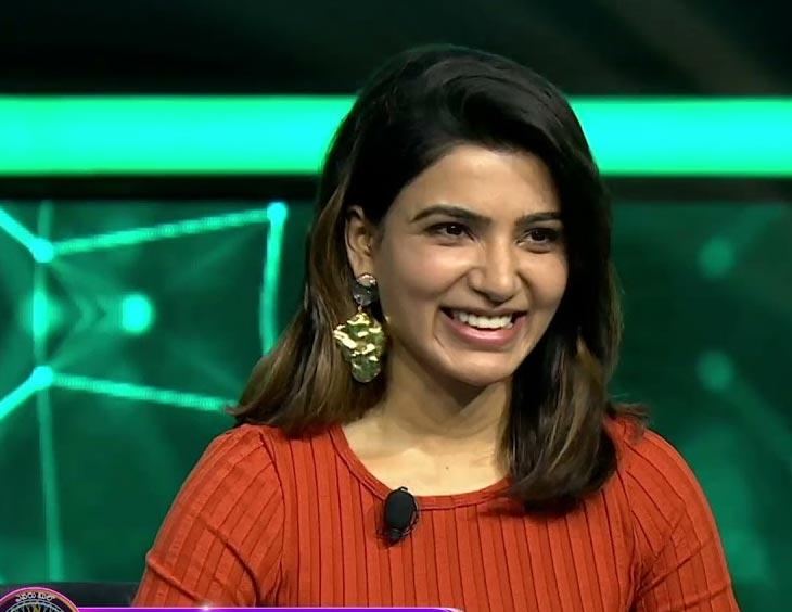 Samantha with a dull face and a dull smile