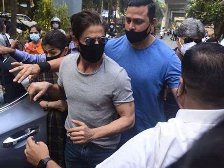 Shah Rukh Khan Hides Under an Umbrella to Avoid media