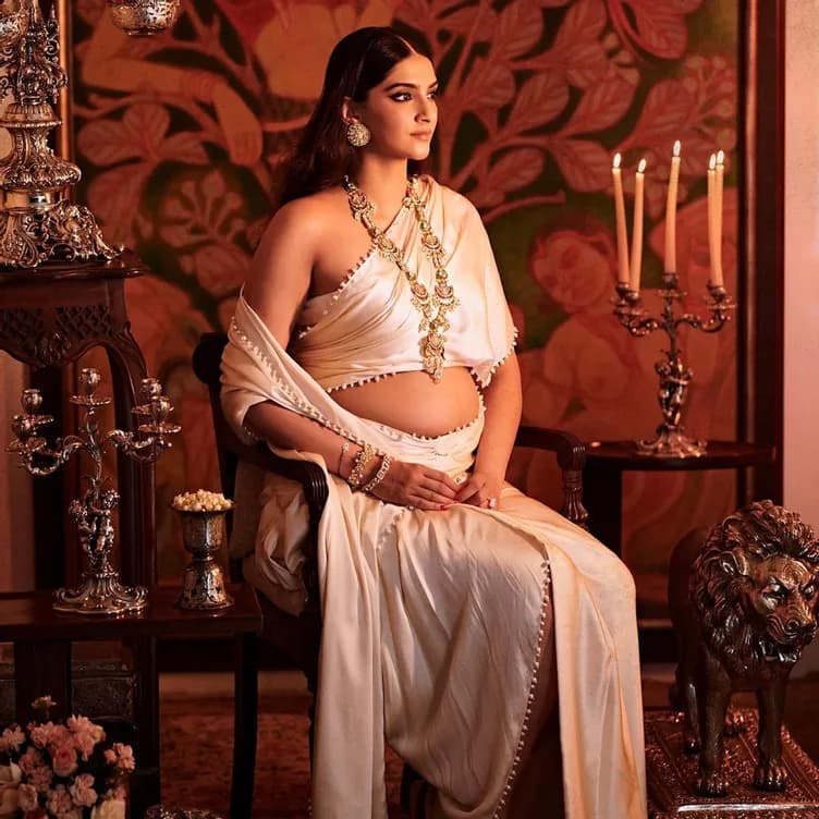 Sonam Kapoor flaunts her baby bump in an ivory drape in new photos
