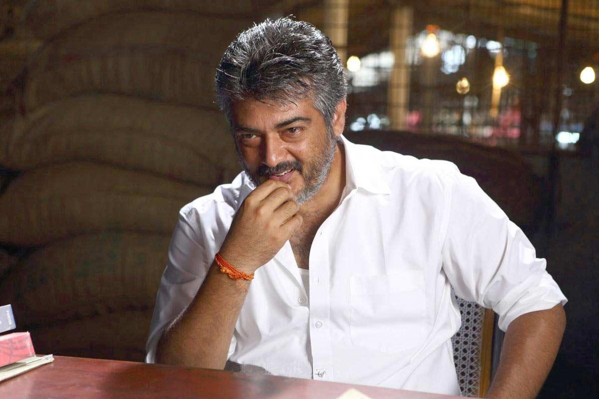 Ajith surprises tying the lace of a crew member