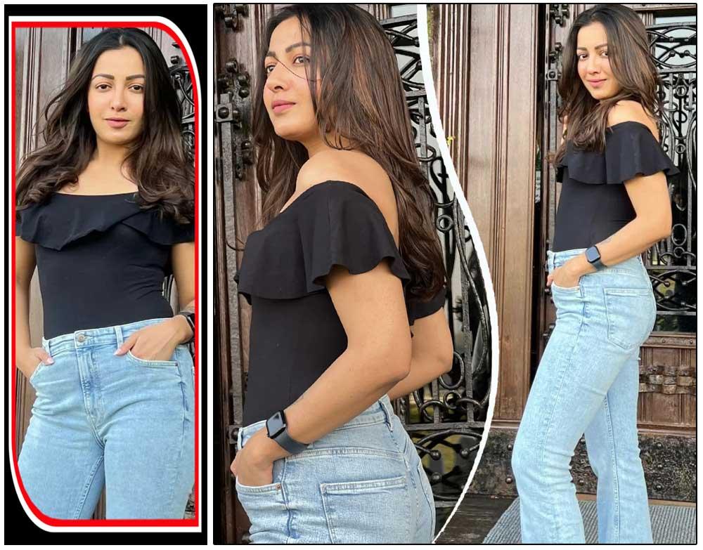 Catherine Tresa kills it with black shirt and blue denim