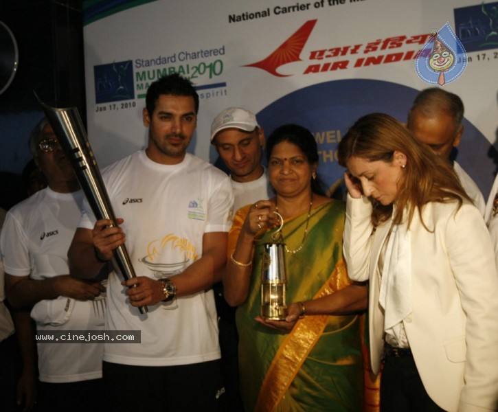 John Abraham,Maria Polyzou At Marathon Flame Run - 11 / 25 photos