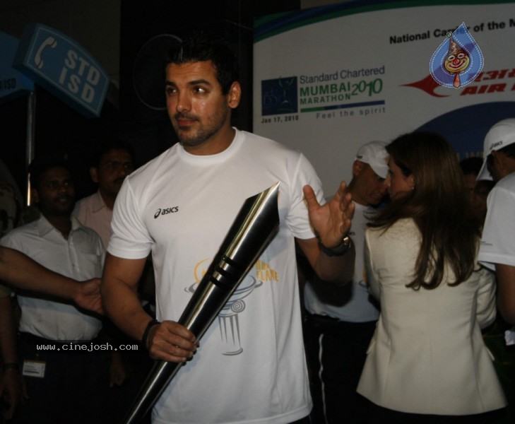 John Abraham,Maria Polyzou At Marathon Flame Run - 12 / 25 photos