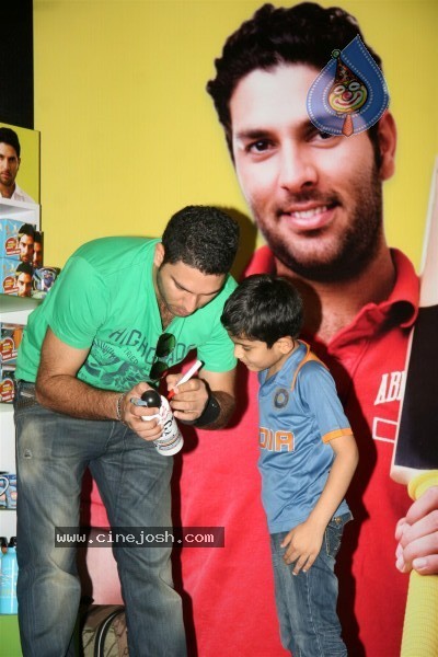 Yuvraj Singh showcasing products at the launch - 4 / 15 photos