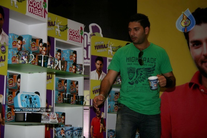 Yuvraj Singh showcasing products at the launch - 12 / 15 photos