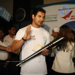 John Abraham,Maria Polyzou At Marathon Flame Run - 3 of 25