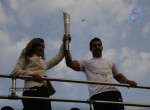 John Abraham,Maria Polyzou At Marathon Flame Run - 10 of 25