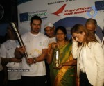 John Abraham,Maria Polyzou At Marathon Flame Run - 11 of 25