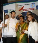 John Abraham,Maria Polyzou At Marathon Flame Run - 14 of 25