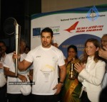 John Abraham,Maria Polyzou At Marathon Flame Run - 18 of 25