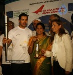 John Abraham,Maria Polyzou At Marathon Flame Run - 20 of 25