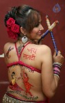 Tanisha Singh Hot Back Painting Photo Shoot - 15 of 31