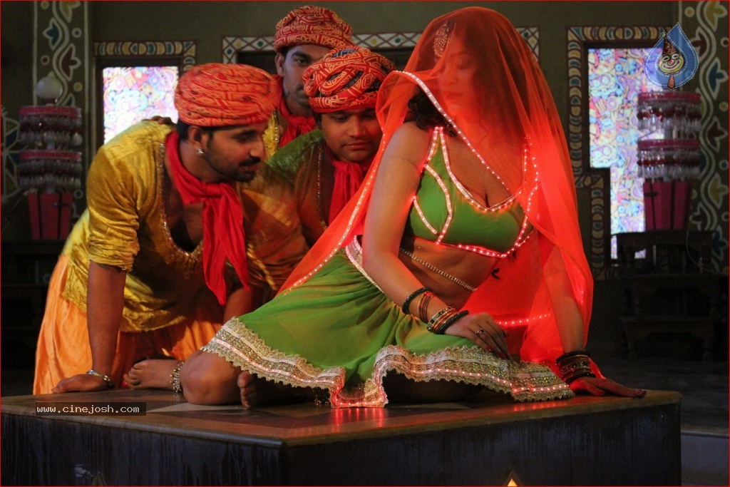 Mumaith Khan Item Song Stills in Aadivaram Amavasya Movie - 24 / 26 photos