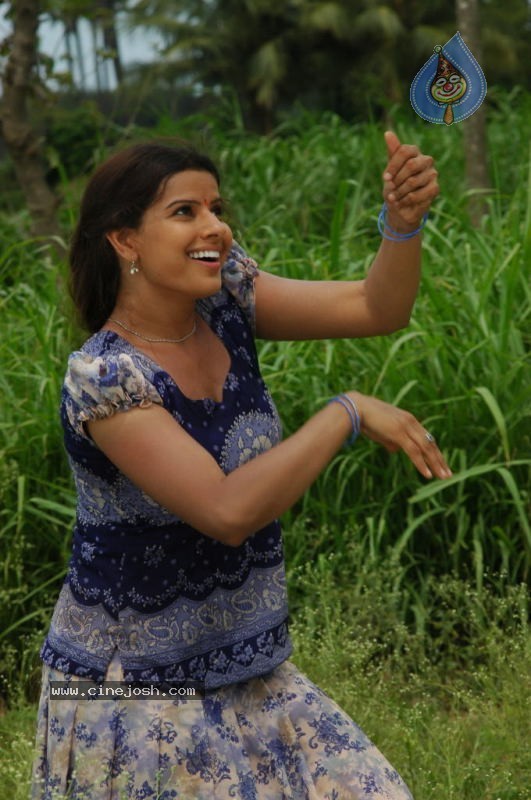Madhu Sharma Spicy Stills In Wall Poster Movie - 32 / 78 photos