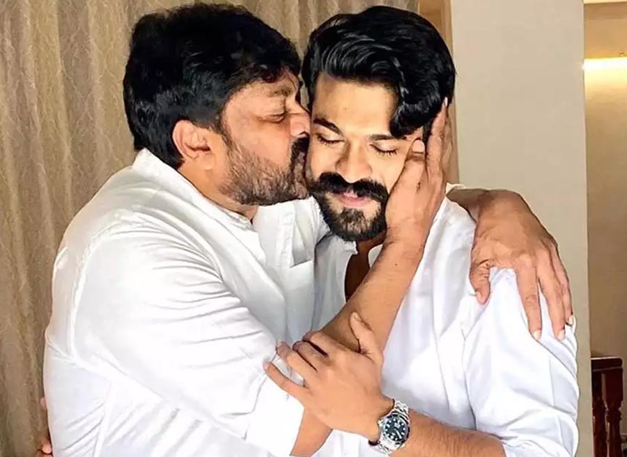 - Chiranjeevi with Ram Charan -