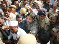 Police arresting MIM activists