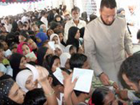 Mr. Asaduddin distributing text books and bags