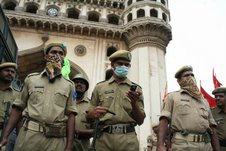 policemen wearing masks to prevent from swine flu