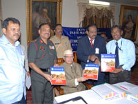 Governor N.D.Tawari releasing a souvenir on Armed Forces