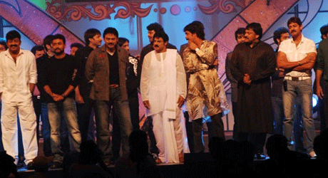 Nagarjuna pulls Chiru onto the “Star Night” dias.