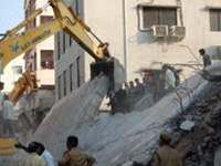 Death toll in building collapse rises to 14