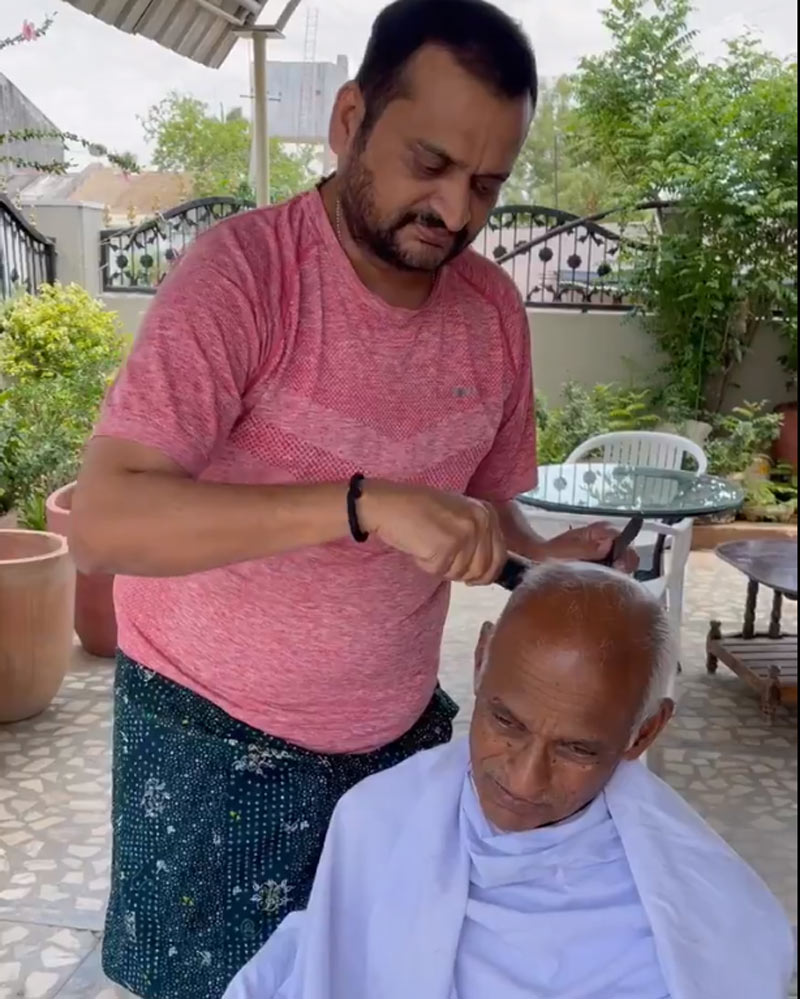 Bandla Ganesh turns barber for father