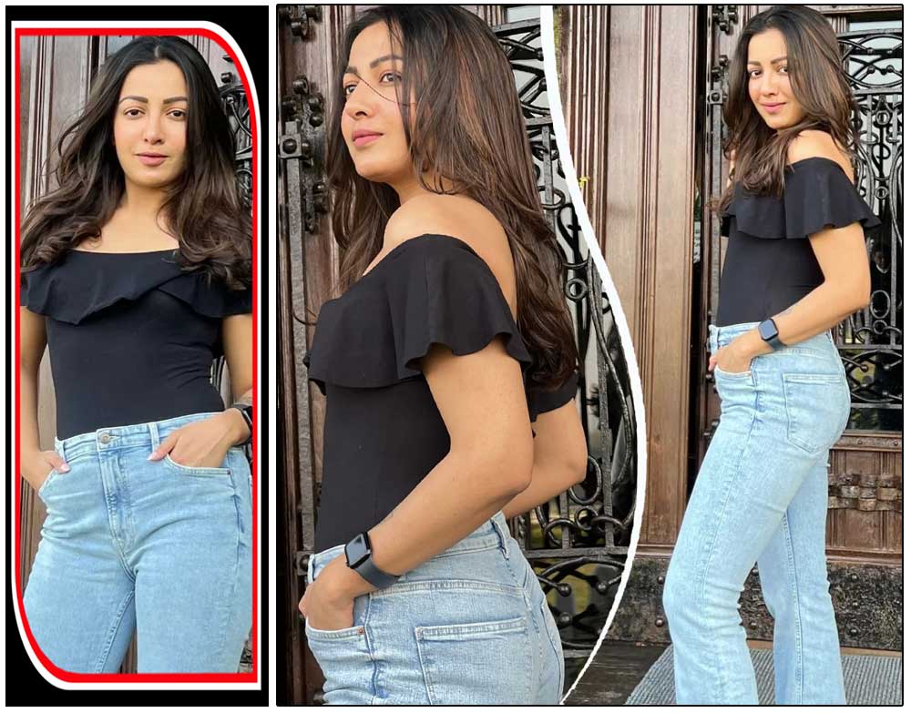Catherine Tresa in black shirt and blue denim
