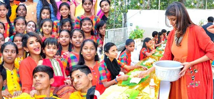 Manchu Lakshmi surprises school kids for Sankranti
