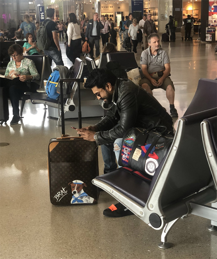 Ram Charan Smiles at Airport