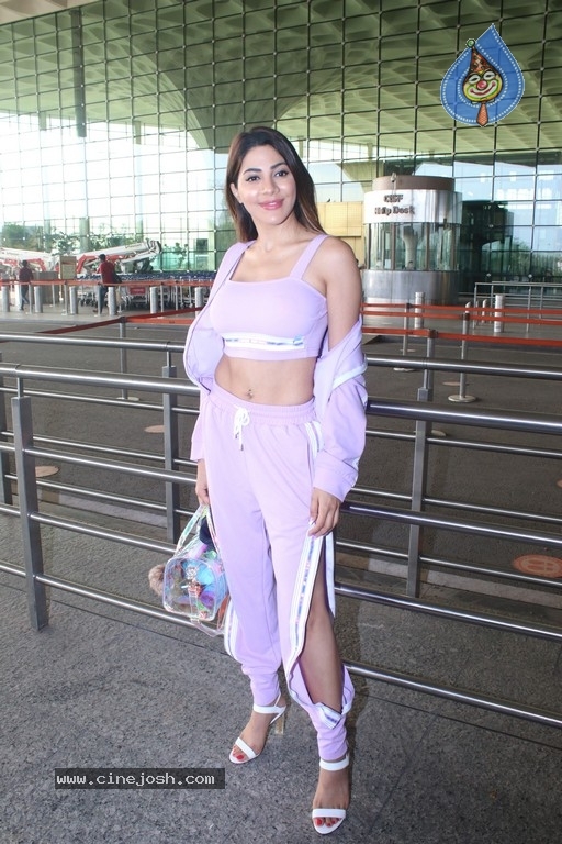 Nikki Tamboli Spotted At Airport - 6 / 17 photos