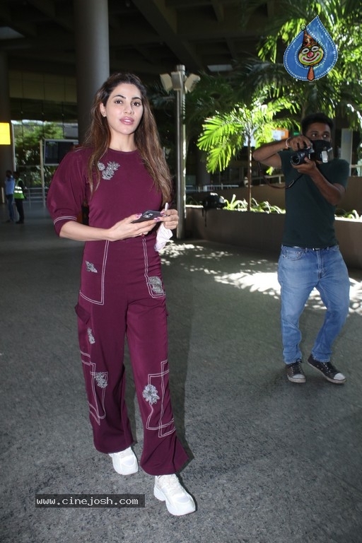 Nikki Tamboli Spotted At Airport - 16 / 19 photos