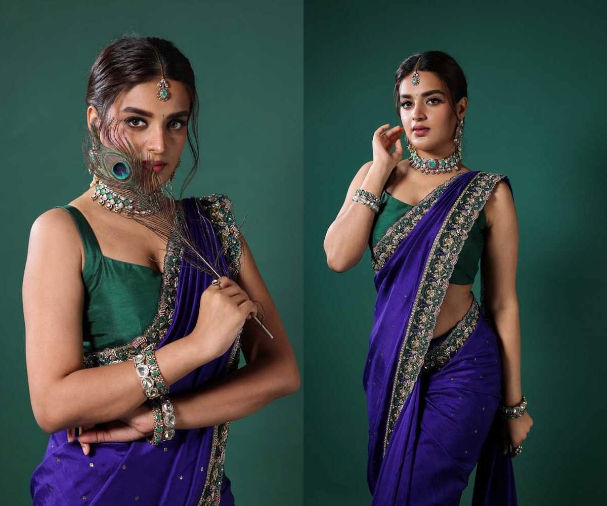 nidhi agarwal  నెమిలి పింఛం తో క్రేజీ హీరోయిన్ 